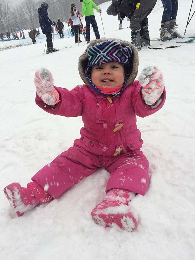 Kid playing in the snow at Mount Peter