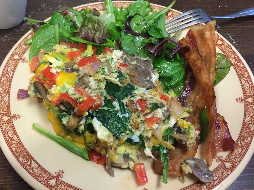 Breakfast plate with eggs and greens